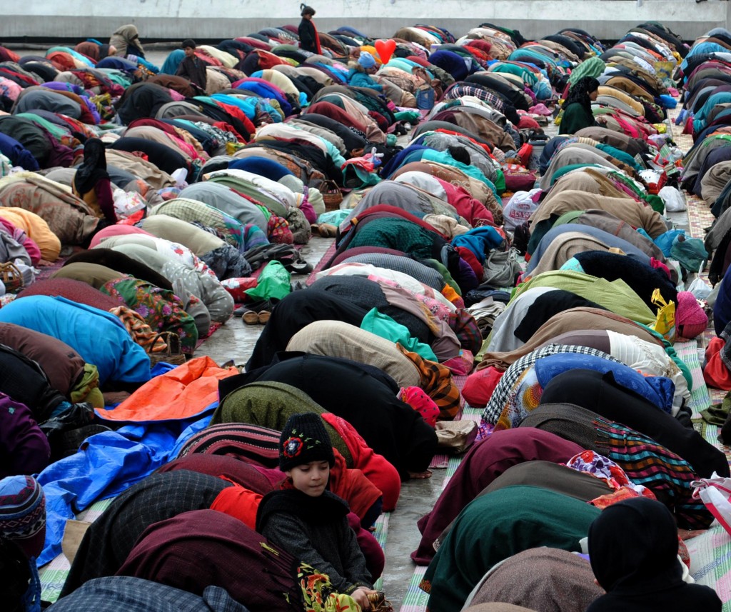 People offer `Durud` on Milad-Un-Nabi at the Hazratbal Shrine in Srinagar on Jan.14, 2014. (Photo: IANS)