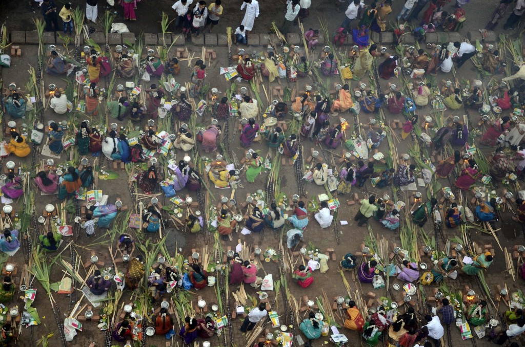 Tamils celebrate `Pongal` at Dharavi in Mumbai on Jan.14, 2014. (Photo: Sandeep Mahankal/IANS)